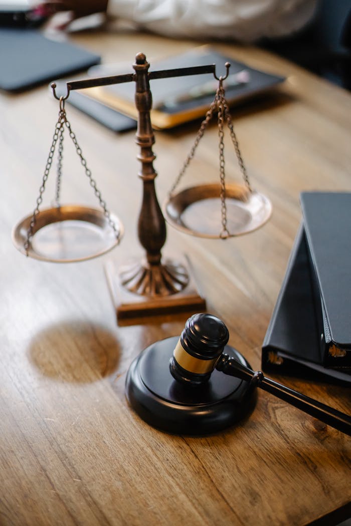 services-02 High angle lawyers desk with decorative judgement scales and gavel in modern law firm